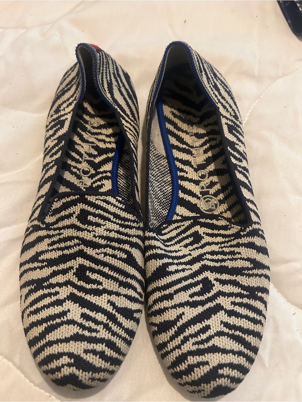 Rothy's Zebra-Print Knit Flats in Navy and Cream